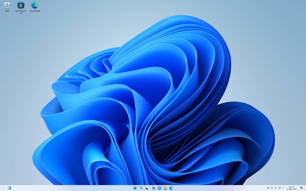 Bureau Winux Linux qui imite parfaitement l'apparence de Windows 11 : de l'arrière-plan à la barre des tâches.